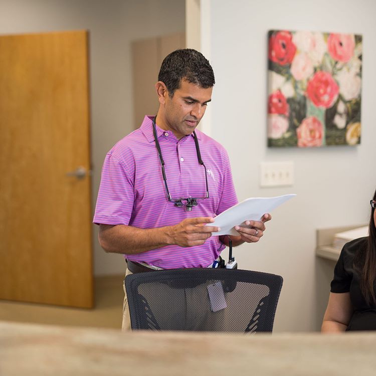Dr. Sanjay Athavale at Work With a Patient | Sandy Springs, GA