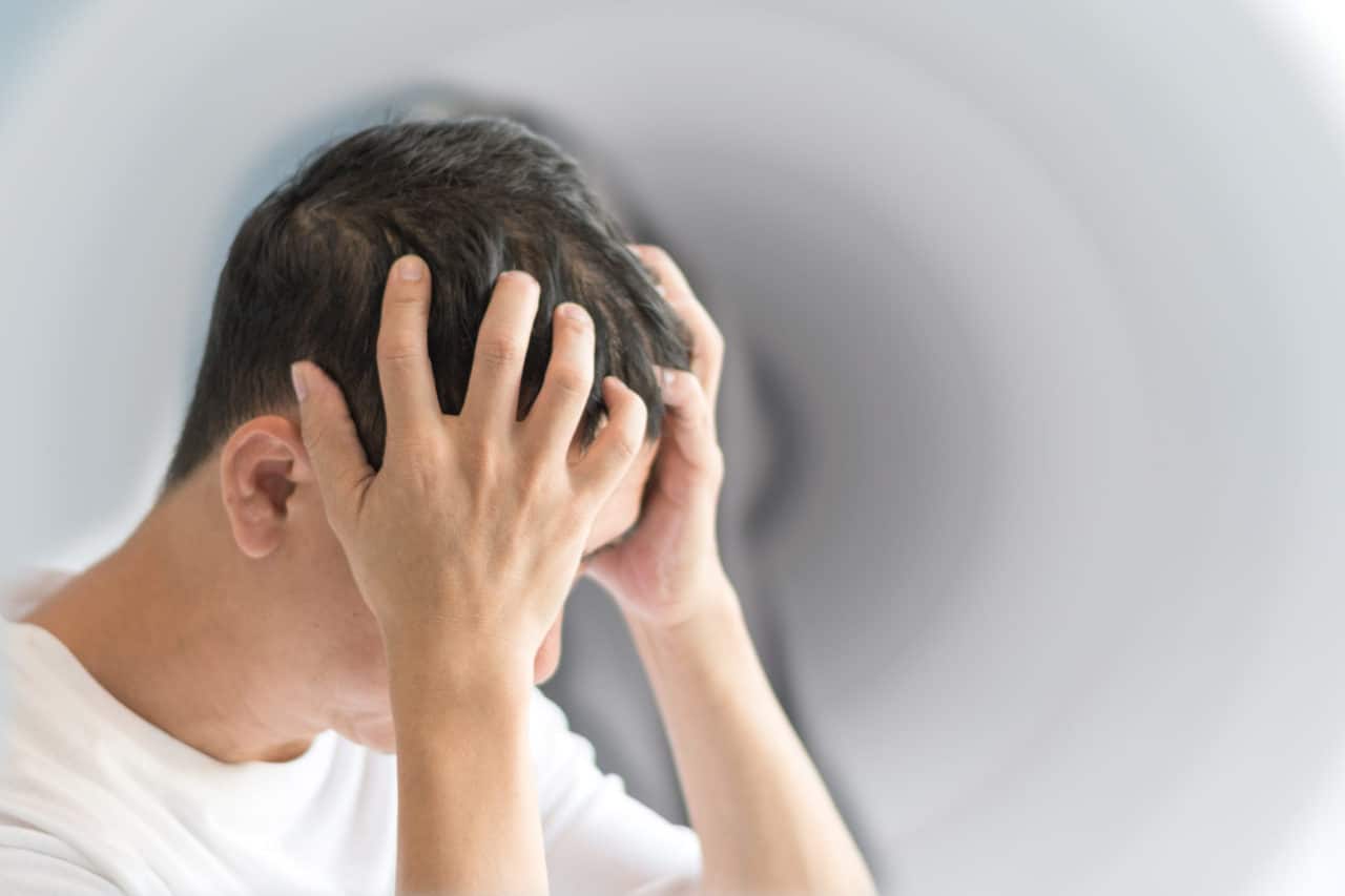 Man Experiencing Dizzy Spell