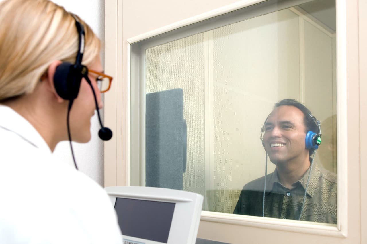 audiology patient completing hearing test